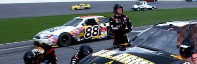 Photo of U.S. Army NASCAR Pit Crew member working in garage.