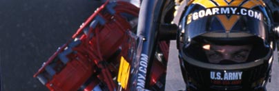 Photo of Tony Schumacher behind the wheel of The Sarge.