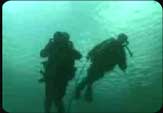 Investigating submerged watercraft is only one of the duties of being an Army Diver.