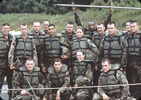 A team of Bridge Crewmembers from the first detachment of the 459th Engineering Company is proud of a job well done. The coordination involved in constructing a bridge requires team members to be experts in their jobs.