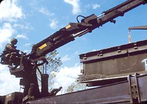 A Bridge Crewmember works on assembling one of the Armys newest dry support bridges. Its a modular bridge that can span a 40-meter gap in 90 minutes. Its used for crossing land gaps.