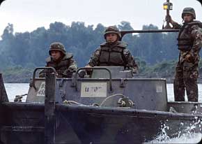 Bridge Crewmembers arrive in their powerful MK2 Bridge boats.  They are used to maneuver floating bridge sections with their twin 212 hp jet-drive engines.