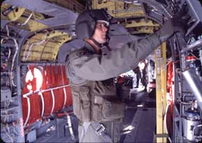 A CH-47 Repairer/Crew Chief performs A pre-flight inspection on one of the Chinook's hydraulic systems. 15Us are trained to be experts on virtually every system of the CH-47.inspection on one of the Chinooks hydraulic systems. 15Us are trained to be experts on virually every system of the CH-47.pre-flight inspection on one of the Chinooks hydraulic systems. 15Us are trained to be experts on virually every system of the CH-47.