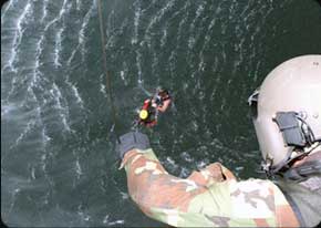 A CH-47 Crew Chief lowers a winch during 
a water rescue exercise. Chinooks are used 
for a variety of military and civilian rescue 
operations.